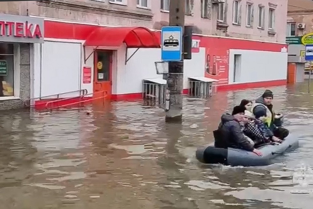 Residents in a boat on a flooded street in Orsk, Russia, on Sunday. A dam failure caused by high water levels in the Ural River has put thousands of people in the flooding zone, according to officials. Photo:  EPA-EFE via Russia Emergency Situations Ministry Press Service