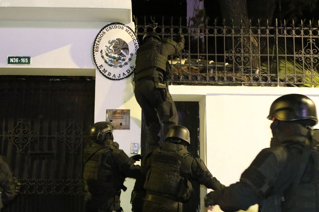 Ecuadorian police special forces enter the Mexican embassy in Quito on Friday. Photo: AFP