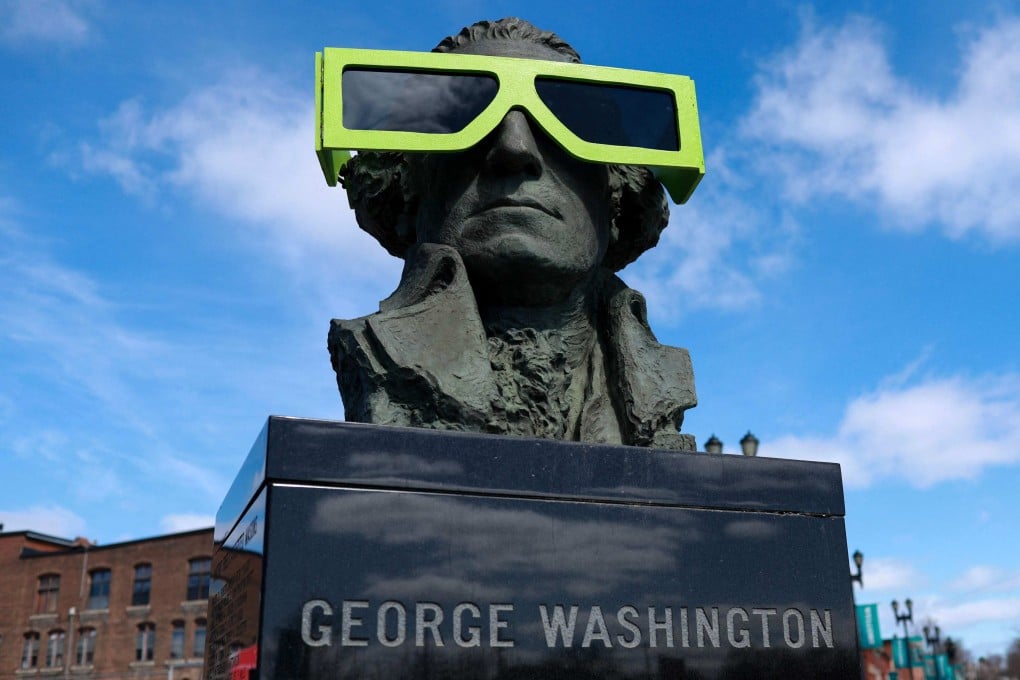 Eclipse glasses on a statue of George Washington, in Houlton, Maine. Photo: AFP