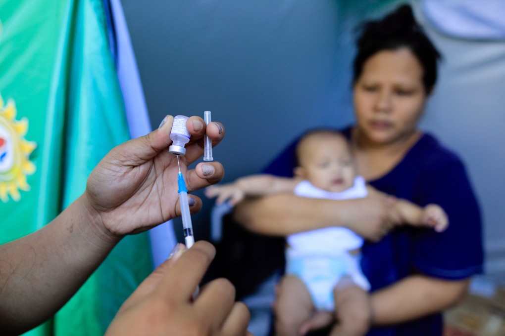 A Filipino health worker prepares a vaccine shot in Paranaque city, Metro Manila. The Philippines has some of the lowest child vaccination rates in the world, according to Unicef data. Photo: EPA-EFE