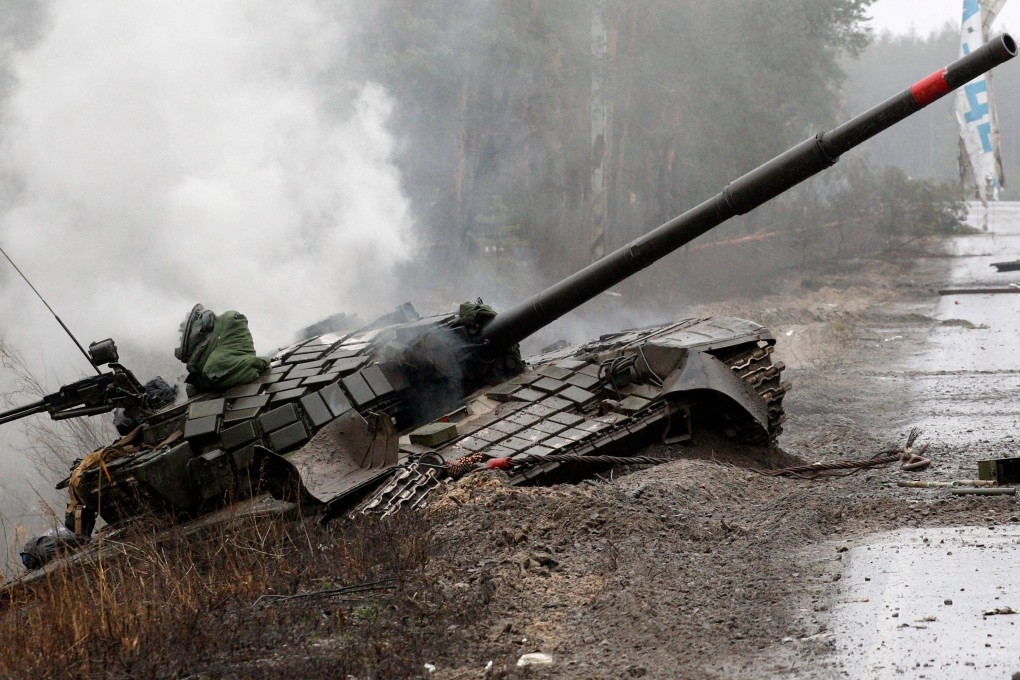 Smoke rises from a Russian tank destroyed by Ukrainian forces. According to UK intelligence, Russia is losing close to a 1,000 troops a day on the Ukraine battlefield. Photo: AFP