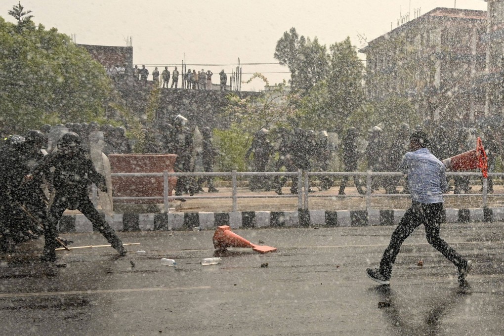 Security personnel use water cannon to disperse demonstrators during a protest to demand the restoration of monarchy and the status of a Hindu state in the nation. Photo: AFP