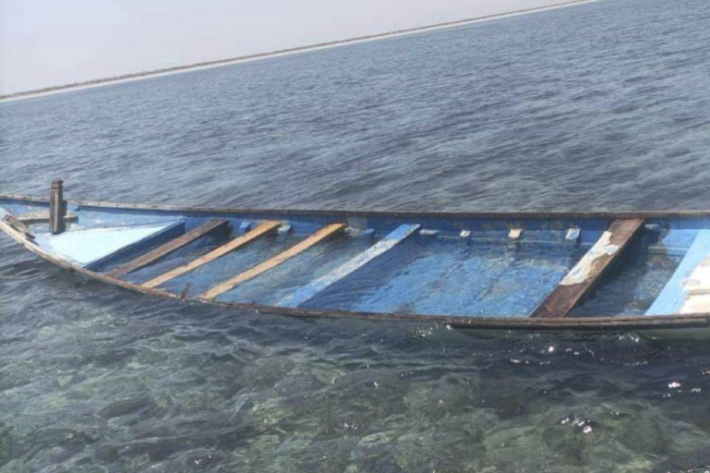 A capsized boat is seen near the coastal town of Obock, in northeastern Djibouti on Tuesday. Photo: International Organization for Migration via AP