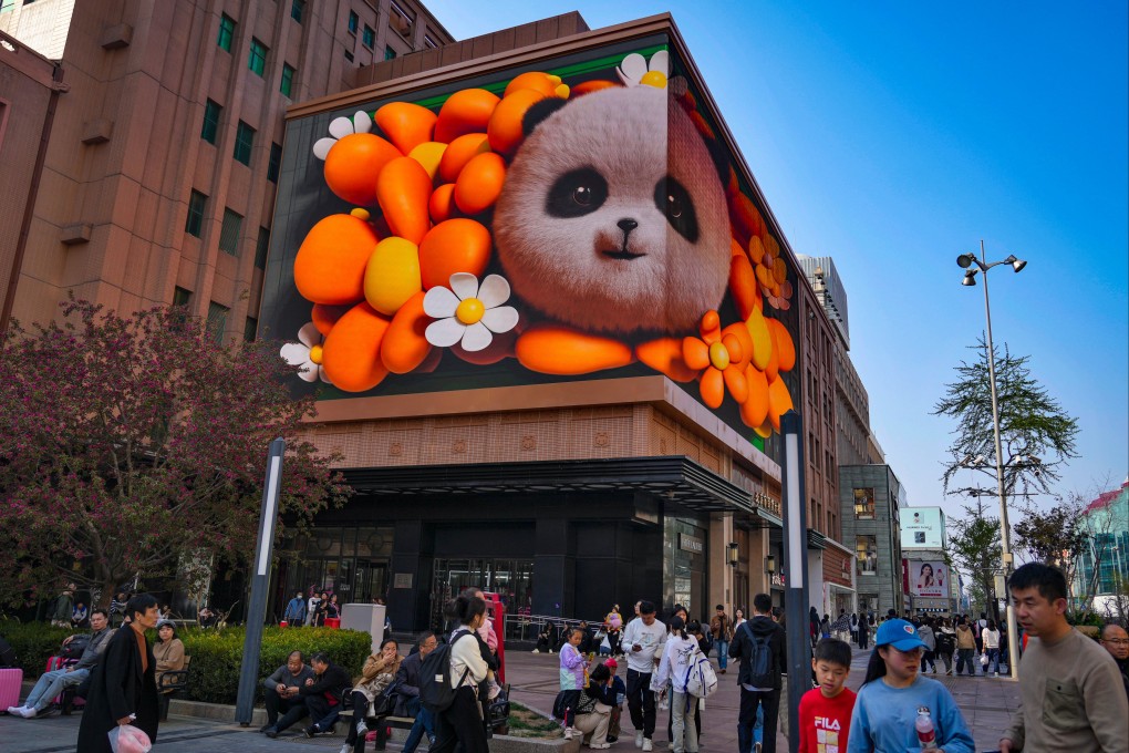 Shoppers are pictured near a shopping mall in Beijing on April 5, 2024. Photo: AP
