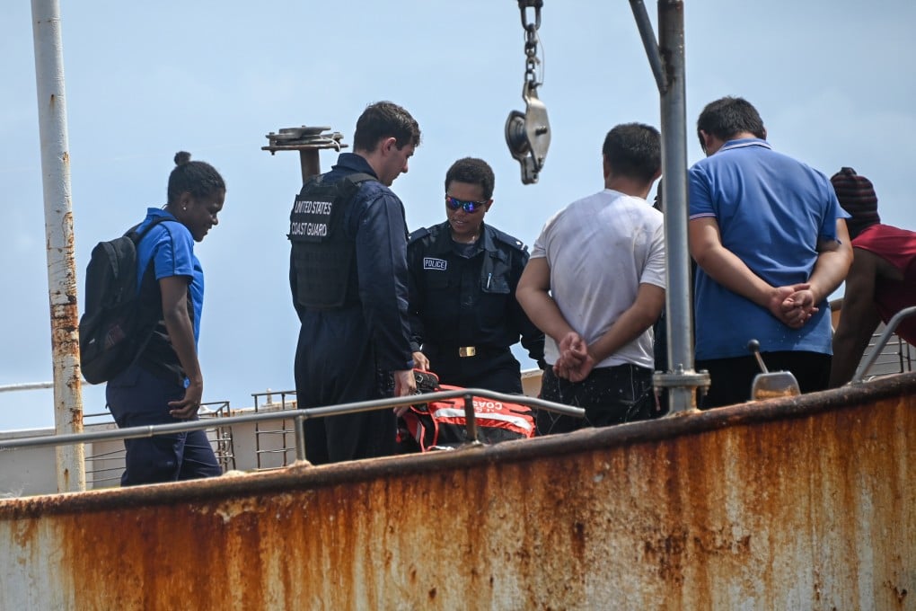 Vanuatu fisheries and police officials board a vessel in February alongside a US Coast Guard boarding team. Photo: US Coast Guard Pacific Area