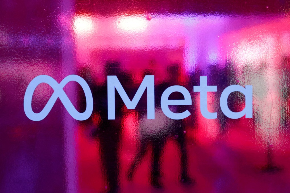 People walk behind a Meta Platforms logo during a conference in Mumbai, India, September 20, 2023. Photo: Reuters