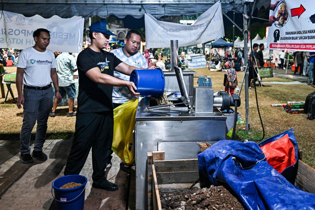 A Ramadan bazaar trader throws food waste into a composting machine in Kuantan, in Malaysia’s Pahang state, on April 3. After breaking their Ramadan fast, people throw their leftovers into a machine that converts the food scraps into organic fertiliser for crops as part of a Pahang government initiative to reduce food waste. Photo: AFP