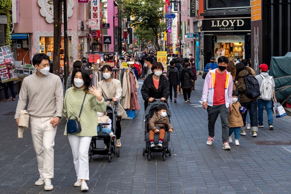 People in the shopping district of Myeongdong in Seoul. The attack is the latest in a string of misogynistic cases involving women with short, cropped hair in South Korea. Photo: Shutterstock