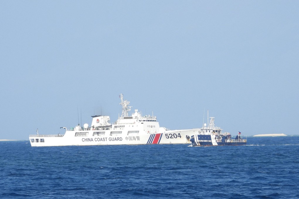 A China Coast Guard ship (left) blocks a Philippine vessel (right) near the Manila-held Thitu Island in the disputed South China Sea on March 23, 2024. Photo: AFP