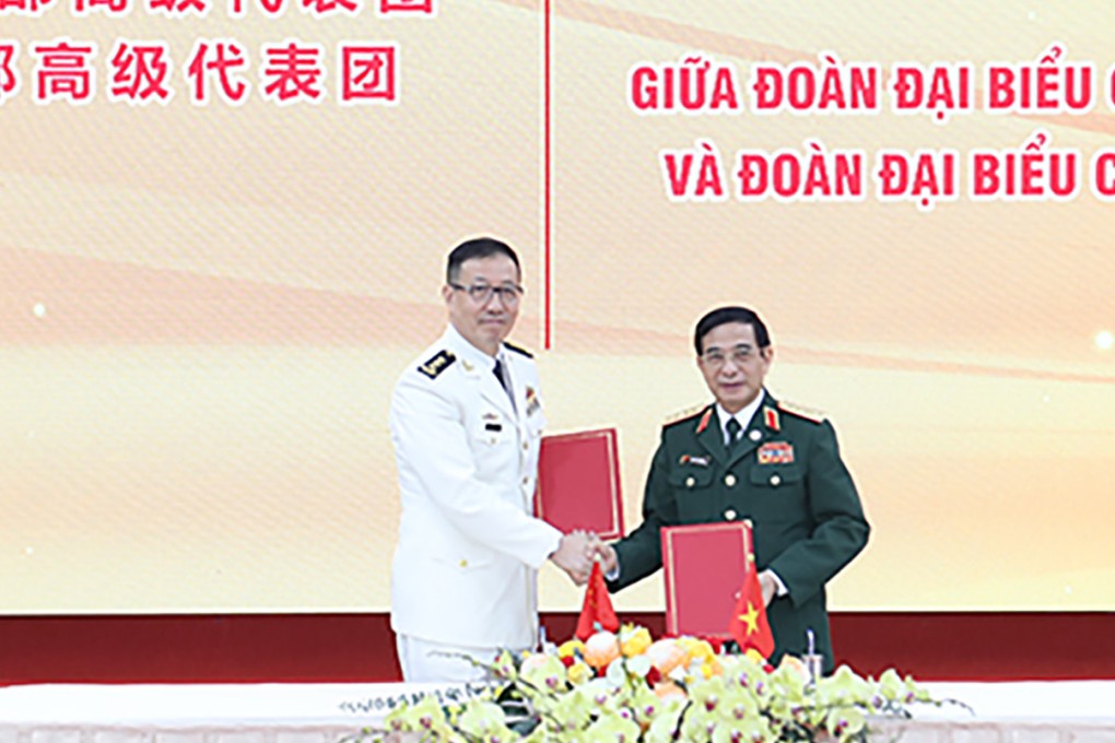 Chinese Defence Minister Dong Jun (left) and his Vietnamese counterpart Phan Van Giang after signing the memorandum of understanding on the South China Sea hotline. Photo: Vietnam Ministry of National Defence