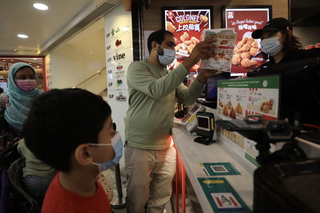A Muslim family buys a halal-certified KFC meal at the fast-food chain’s Chuang’s London Plaza store in Jordan on November 4, 2022. Photo: Xiaomei Chen