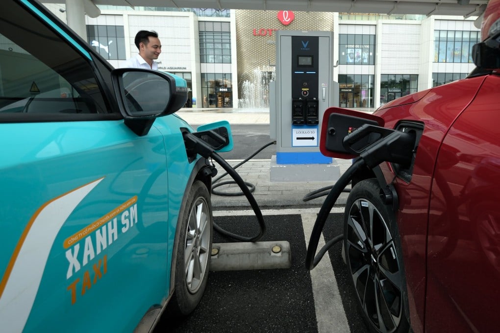 Cars recharge at an electric vehicle charging station in Hanoi on April 8. Asia must develop a skilled labour force capable of supporting its energy transition. Photo: EPA-EFE
