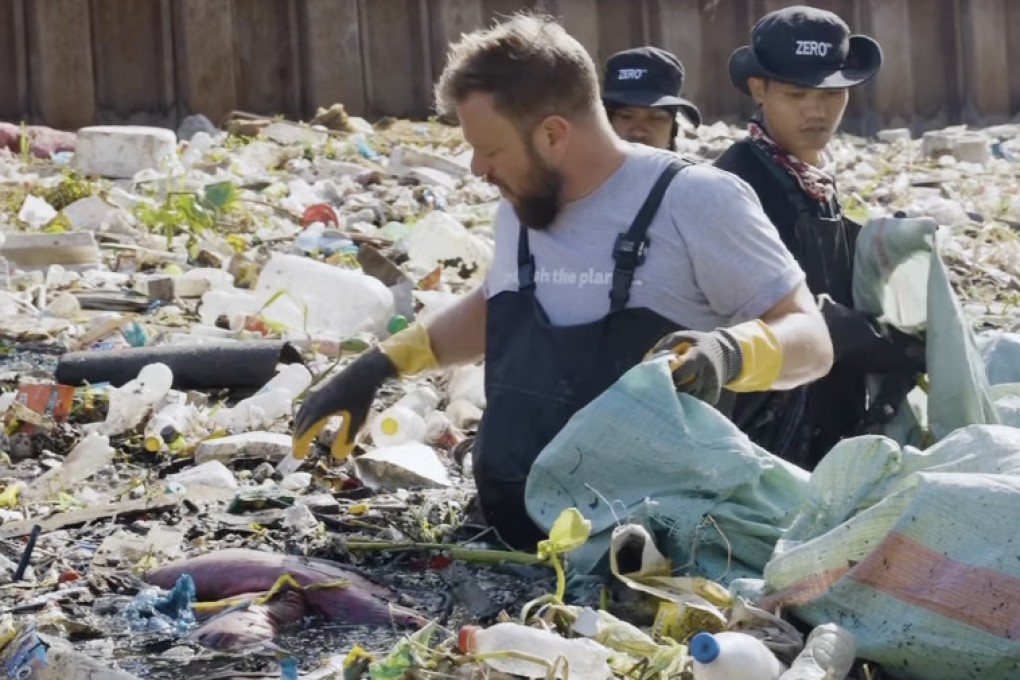 Australian entrepreneur Mike Smith picks up trash in the waste-filled Taguig-Pateros River that runs south of Metro Manila. Photo: Mike Smith/Zero Co