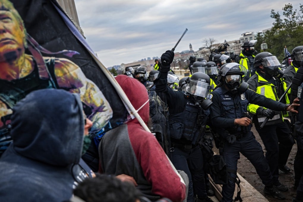 Police officers trying to push back a pro-Trump mob attempting to storm the US Capitol on January 6, 2021. America is deeply polarised, and the coming presidential election is unlikely to mend its fractured social fabric. Photo: Getty Images