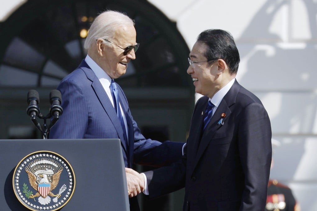 Japanese Prime Minister Fumio Kishida (right) and US President Joe Biden shake hands at the White House on Wednesday ahead of their summit. Photo: Kyodo
