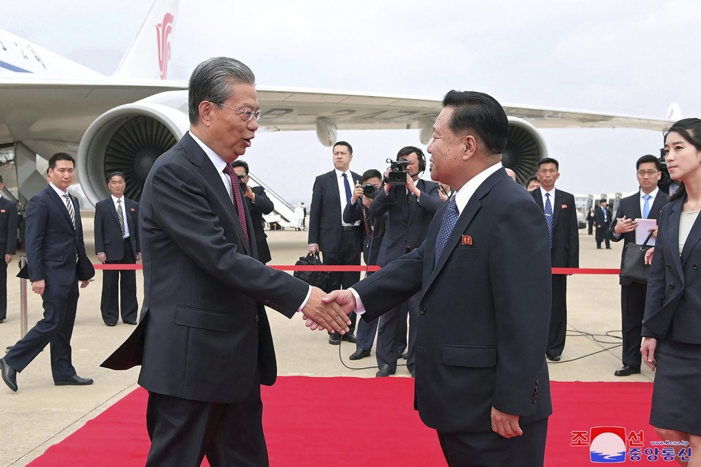 Choe Ryong-hae, vice-chairman of the central committee of the Workers’ Party of North Korea, receives  NPC chairman Zhao Leji at the Pyongyang International Airport on Thursday. Photo: KCNA via AP