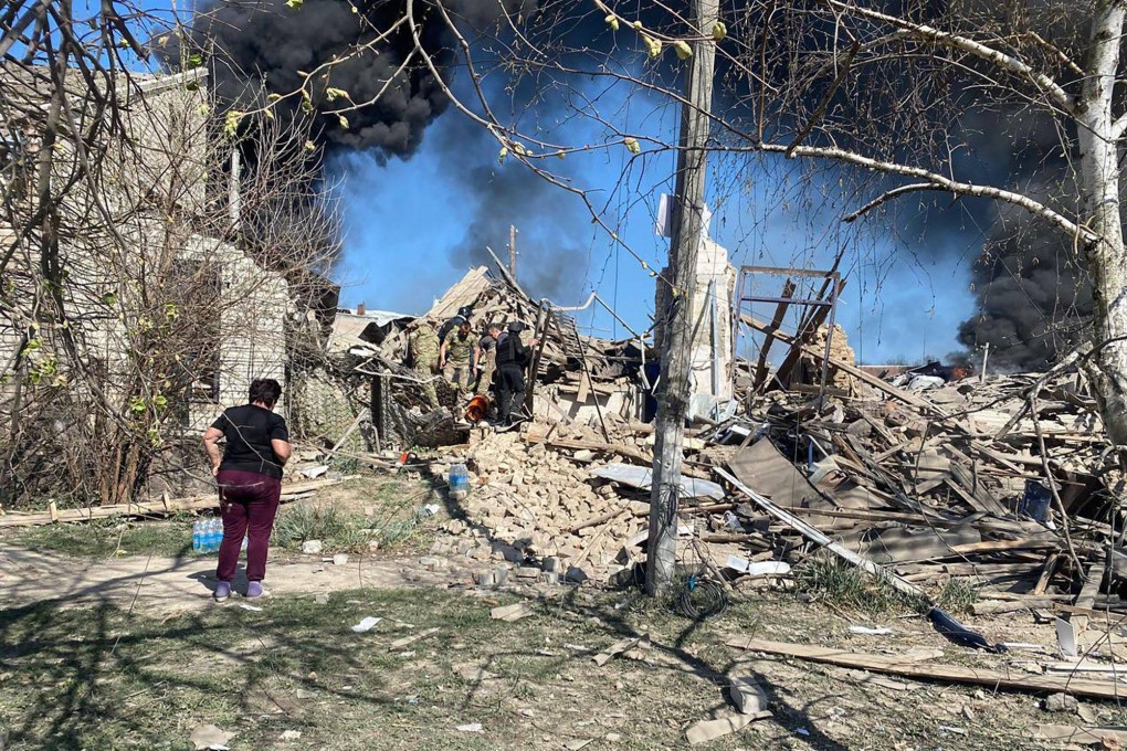 Rescuers working at the site of a missile attack that killed a child and two women in Lyptsi, Kharkiv region, Ukraine on Wednesday. Photo: Telegram / @synegubov / AFP / Handout