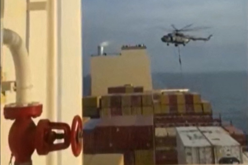 This image grab taken from social media on Saturday shows Iran’s Revolutionary Guards over a container ship named MSC Aries. Photo: via AFP