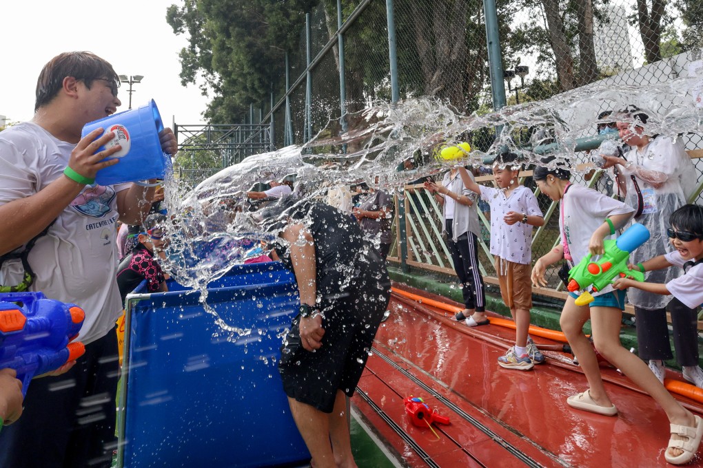 Songkran is celebrated in Kowloon City on Saturday. Participants splashed and sprayed water as a way to symbolically send luck and happiness. Photo: Dickson Lee