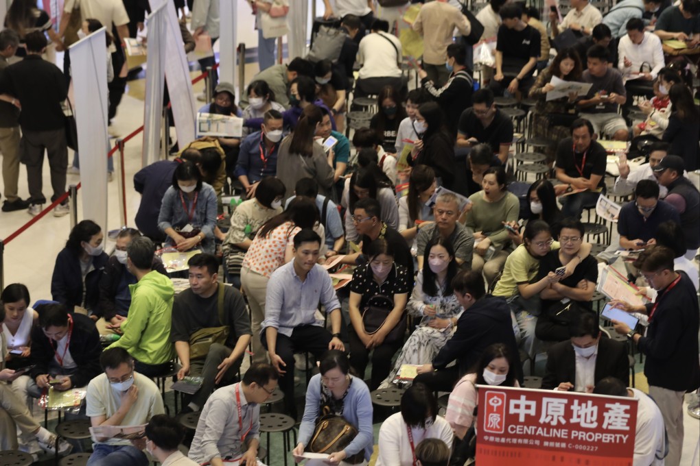 Prospective homebuyers gathered at CK Asset’s sales office in in Hung Hom to wait for the results of the Blue Coast lottery. Photo: SCMP/ Xiaomei Chen