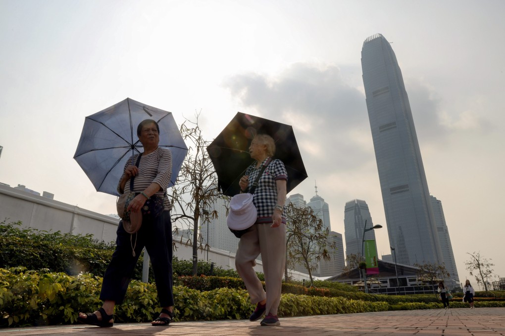 People walk through Admiralty. The forecaster said Saturday’s temperatures were due to an anticyclone bringing fine and hot weather to the coastal areas of Guangdong province. Photo: Yik Yeung-man