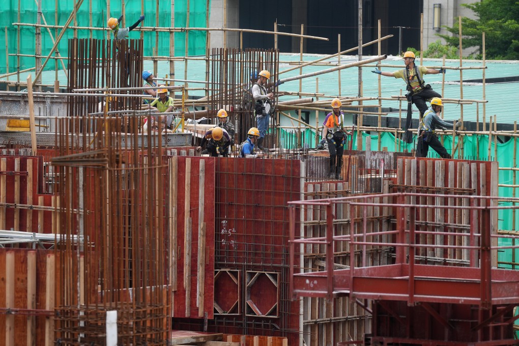 Construction workers will be given points for not following safety rules such as not wearing a helmet on site. Photo: Elson Li