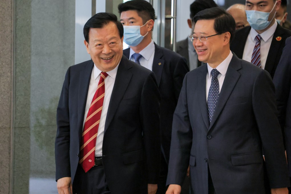 Hong Kong and Macau Affairs Office director Xia Baolong (left) and Chief Executive John Lee attending a meeting last year. Photo: Jelly Tse