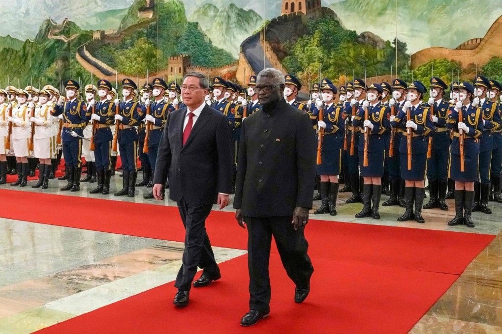 Solomon Islands’ Prime Minister Manasseh Sogavare (right) and China’s Premier Li Qiang inspect a guard of honour during a welcome ceremony at the Great Hall of the People in Beijing in July last year. Photo: AFP
