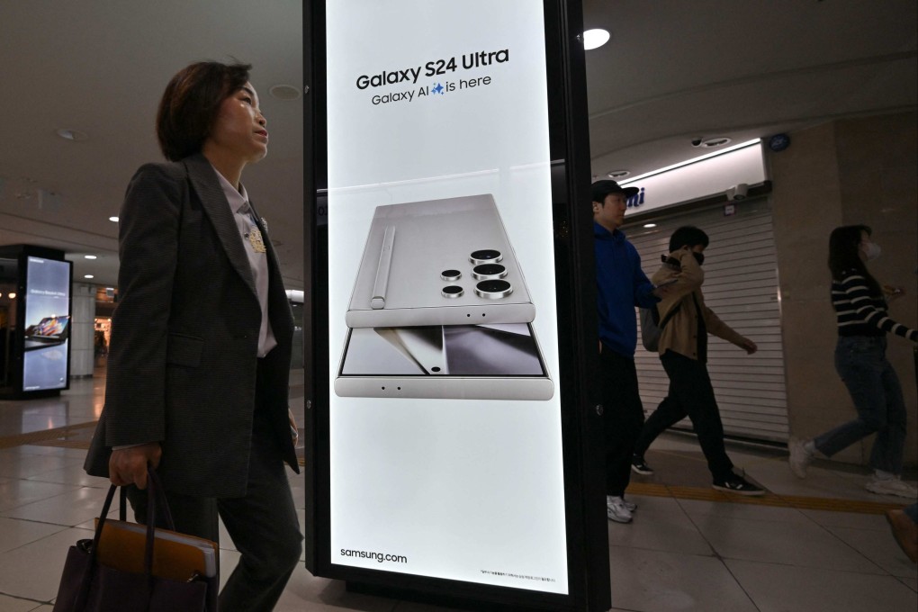 People walk past an advert display for Samsung Electronics' Galaxy S24 smartphone at a subway station in Seoul on April 5, 2024. Photo: AFP