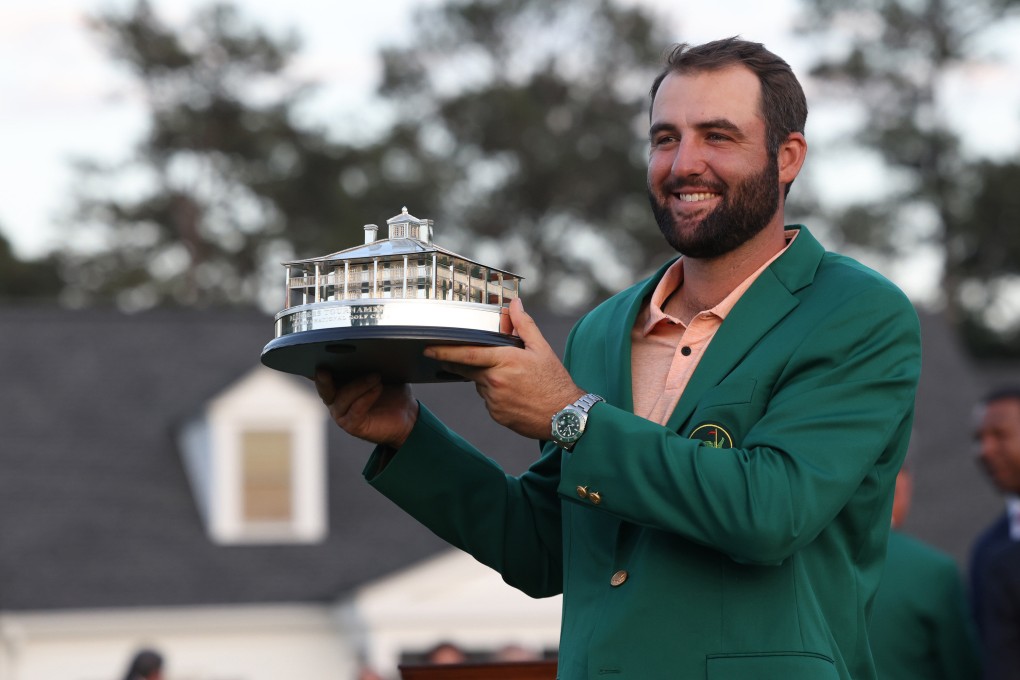 Scottie Scheffler holds the Masters Champion trophy at Augusta National Golf Club. Photo: TNS