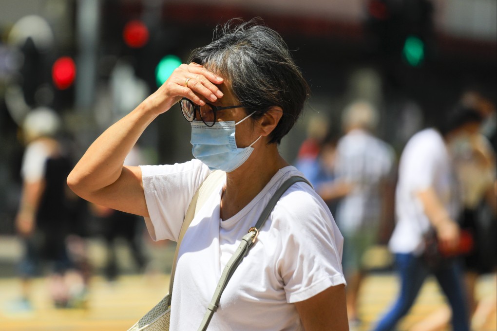 A woman shades her eyes in Causeway Bay, Hong Kong, on September 15, 2022. In Asia, the main problem is rising heat and more variable rainfall. Photo: Xiaomei Chen