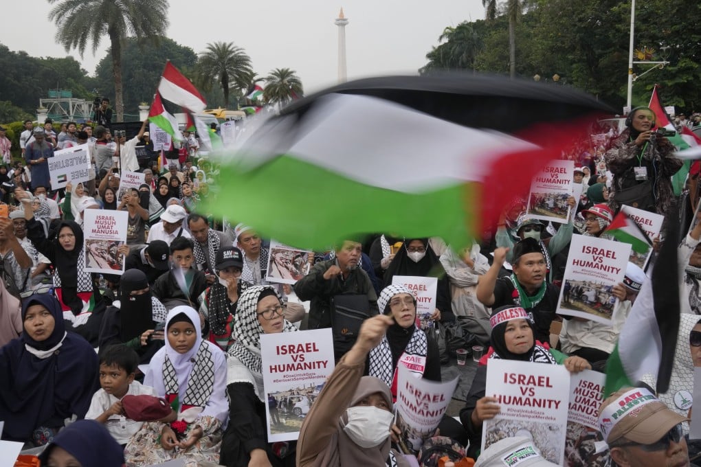 Protesters wave Palestinian flags during a rally in Jakarta earlier this month in support of Palestinians in Gaza. Photo: AP