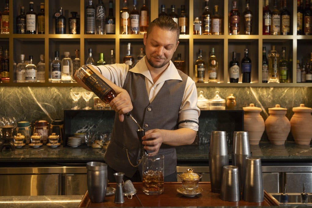 A bartender mixes a drink at Chandu, one of our picks of six of the best hidden speakeasy bars in Singapore. Photo: The Robertson House by the Crest Collection