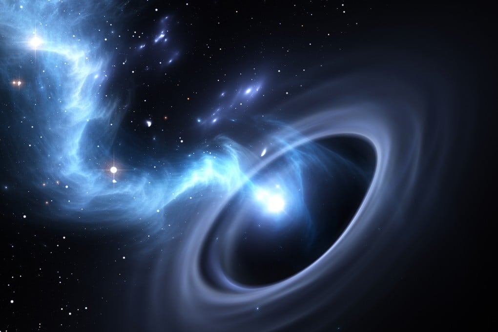 Stars and material falls into a black hole. Photo: Shutterstock