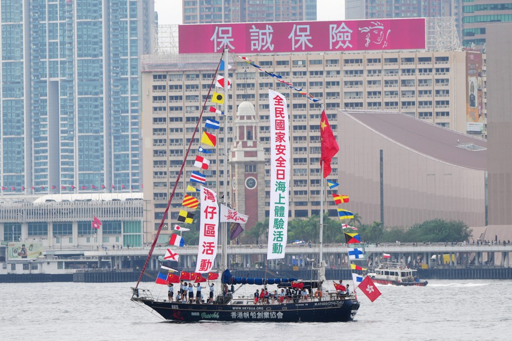A yacht sailing with some students for National Security Education day, is seen on Victoria Harbour. Photo: Sam Tsang