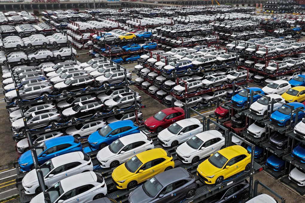 China-made electric cars await export on Tuesday at a container terminal in Jiangsu province. Photo: AFP