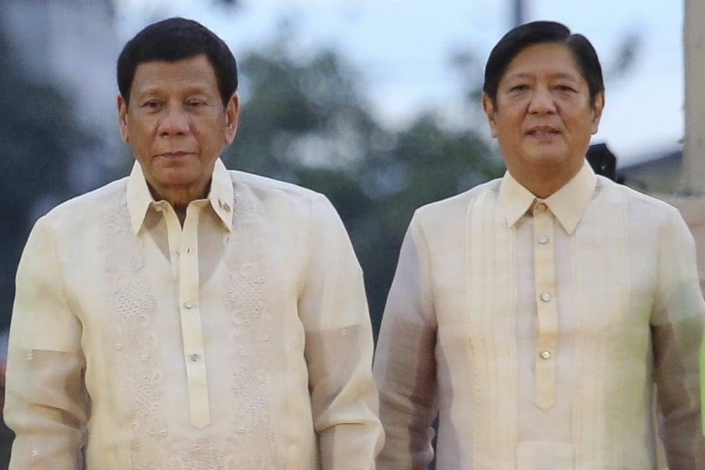Rodrigo Duterte (left) stands beside his incoming successor, Philippine President Ferdinand Marcos Jnr, at Vice-President-elect Sara Duterte’s oath-taking rite in Davao city, in June 2022. Photo: AP