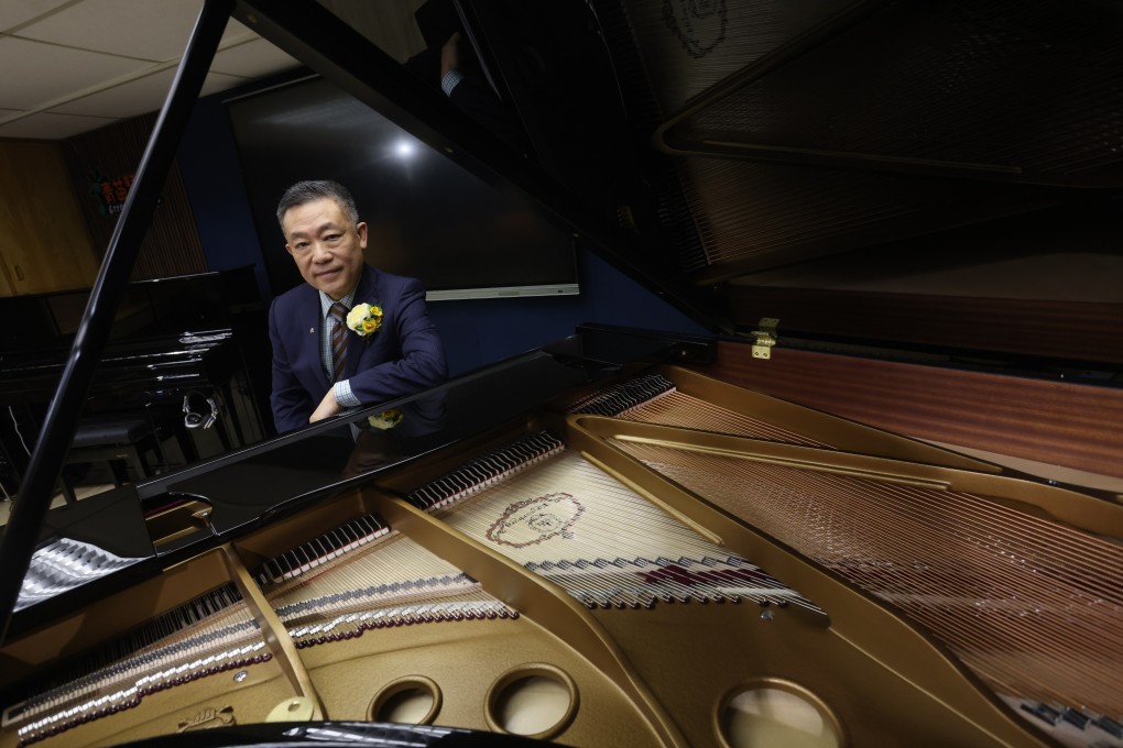 Chinese piano maker Pearl River’s director of global sales and marketing, Tshua Leng, with a Kayserburg grand piano made by the company. The Guangzhou-based group is trying to make headway globally and rival the likes of Yamaha and Steinway. Photo: Jonathan Wong