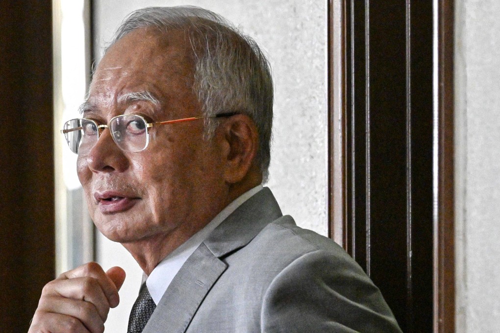 Najib Razak, former prime minister of Malaysia, looks on as he is escorted by prison officers on Wednesday during an appeal hearing at the Kuala Lumpur High Court. Photo: AFP