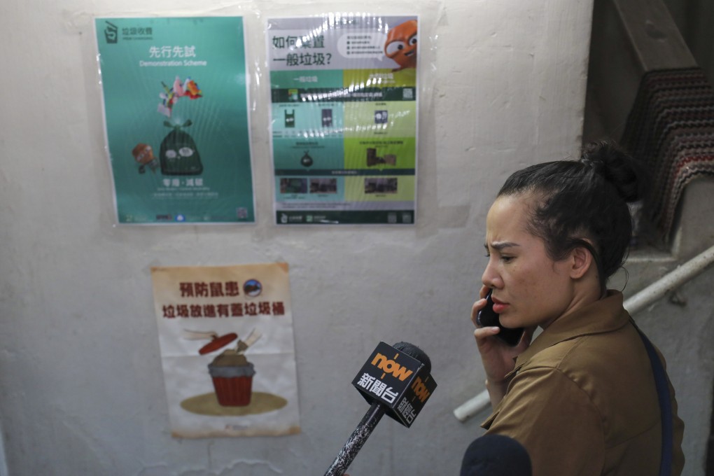A resident’s view is sought on the trial run of the waste charging scheme, taking place in 14 locations across Hong Kong from April 1. Photo: Xiaomei Chen