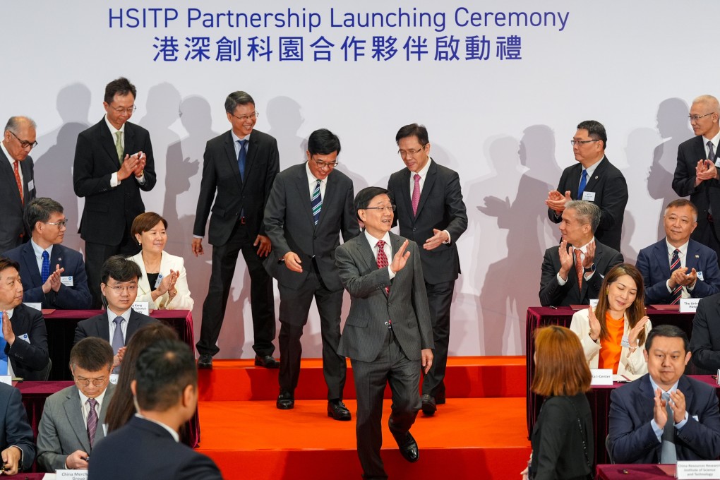Chief Executive John Lee (centre) celebrates the first group of partnership sign-ups for the city’s new I&T park with other dignitaries. Photo: Eugene Lee