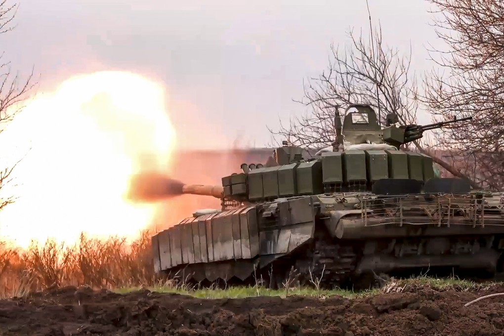 An image released in March shows a Russian tank firing at Ukrainian troops from a position in Russia’s Belgorod region. Photo: Russian Defence Ministry Press Service via AP