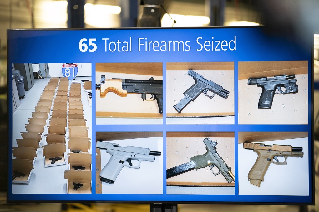 Photos of firearms seized are displayed during a news conference in Brampton, Ontario, Canada on Wednesday. Photo: Canadian Press via AP