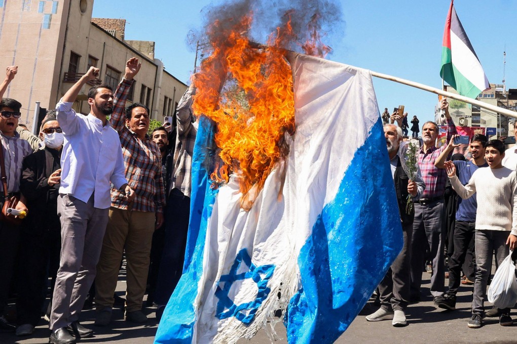 An Israeli flag being burnt during the funeral for seven Islamic Revolutionary Guard Corps members killed in a strike in Syria, which Iran blamed on Israel, in Tehran on April 5. Photo: AFP
