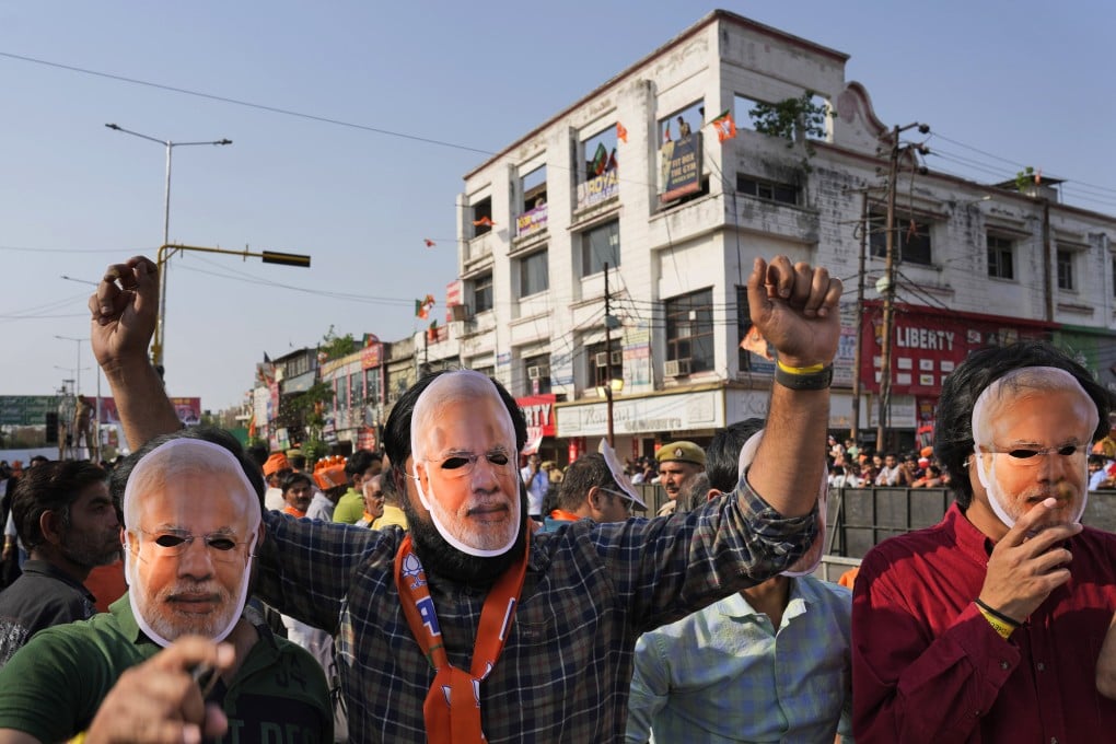 Supporters of Bharatiya Janata Party wear masks of Indian Prime Minister Narendra Modi at an election campaign in Ghaziabad. Modi and his ruling Bharatiya Janata Party are the favourites to win a high-stakes parliamentary election, analysts say. Photo: AP