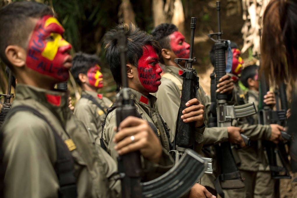 Guerrillas of the New People’s Army (NPA) in formation in the Sierra Madre mountain range, located east of Manila. Photo: AFP