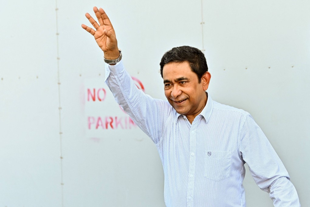 Former Maldives president Abdulla Yameen waves to supporters outside his home in Male on Thursday. Photo: AFP