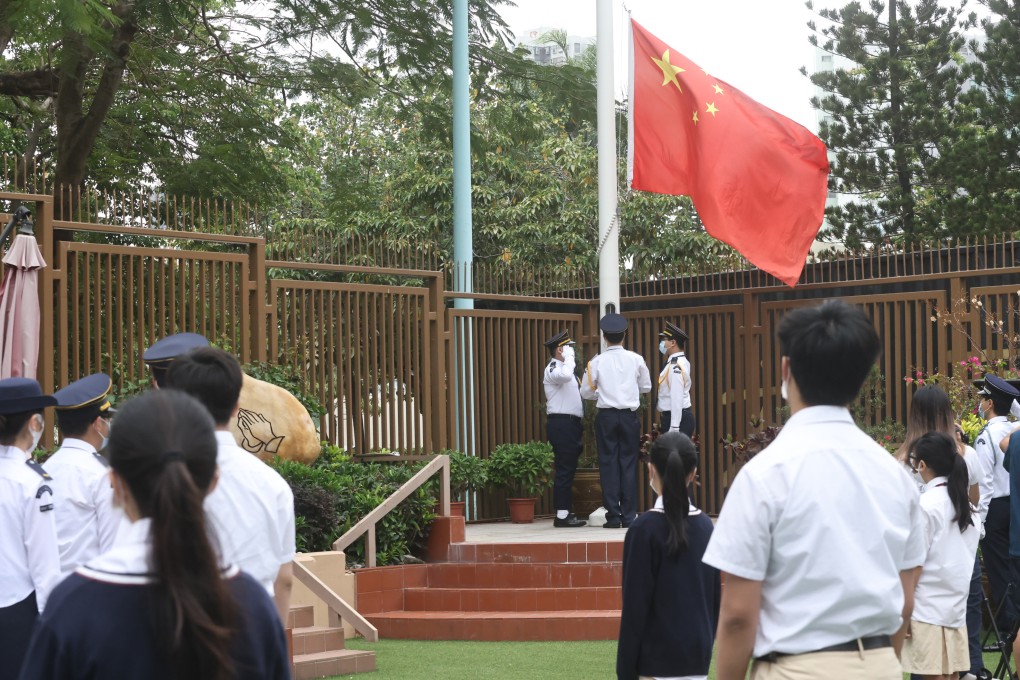 Students at Gertrude Simon Lutheran College attend a flag-raising ceremony during National Security Education Day earlier this week. Photo: K. Y. Cheng