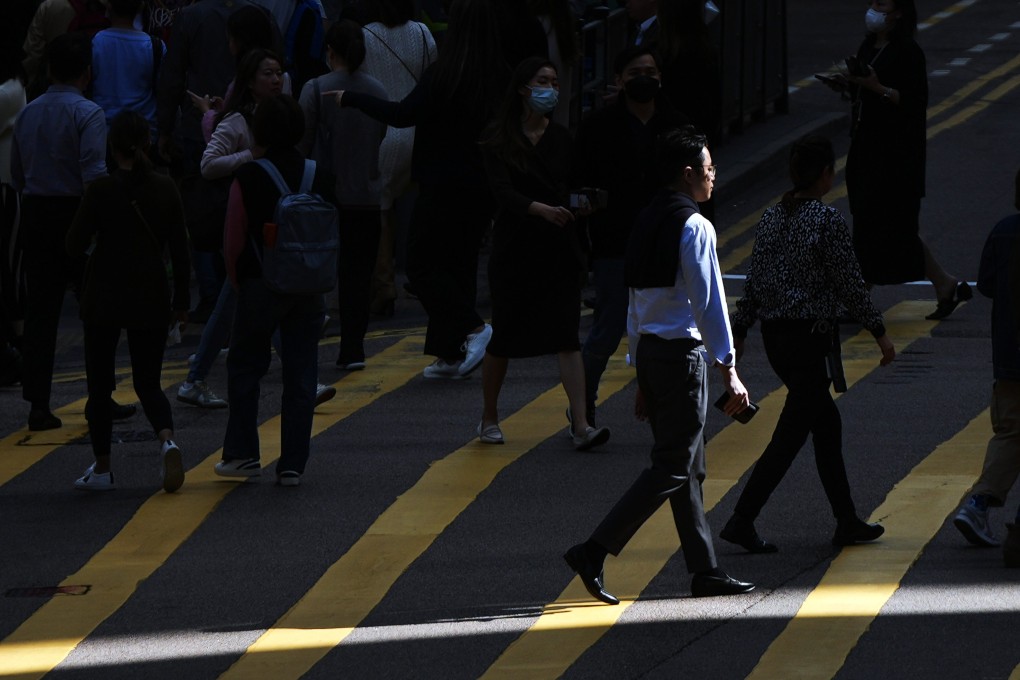Pedestrians in Central. One expert has called for government incentives to help company transition to new ways of working. Photo: Eugene Lee
