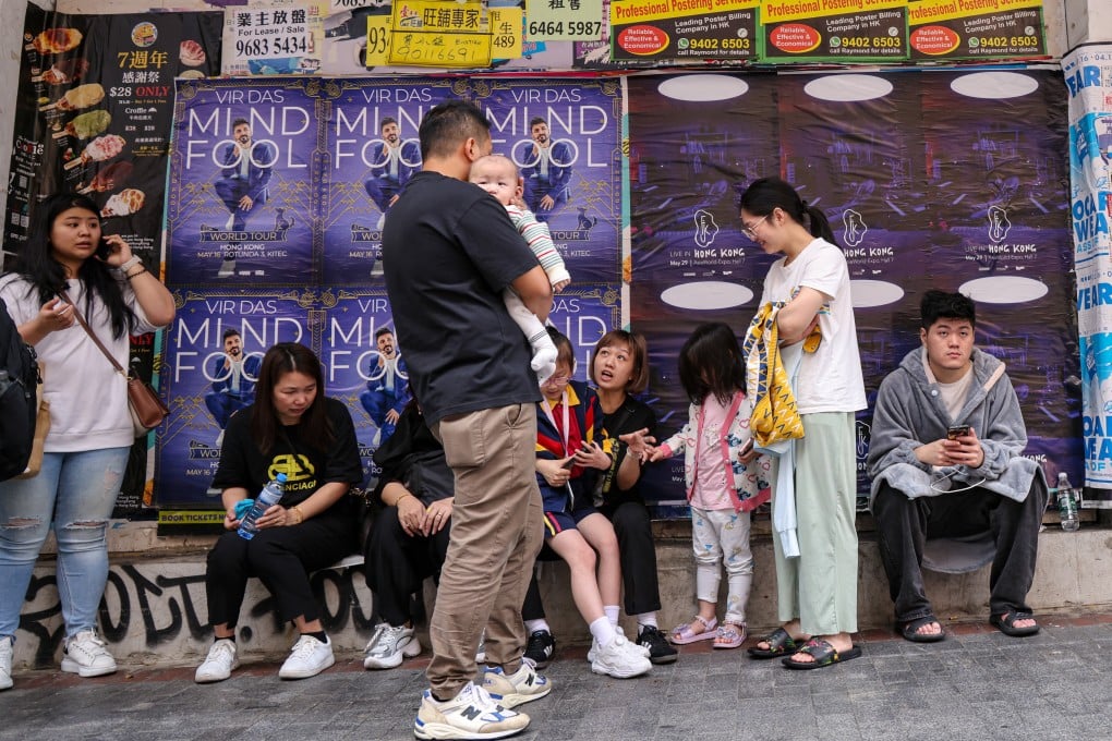 Residents congregate after a fire broke out at New Lucky House in Hong Kong’s Yau Ma Tei neighbourhood on April 10. Photo: Jelly Tse